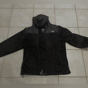 Black North face. Size medium. Has a hood